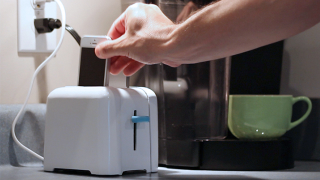 A Charging Station Camouflaged As a Toaster Banishes Crumbs and Cables